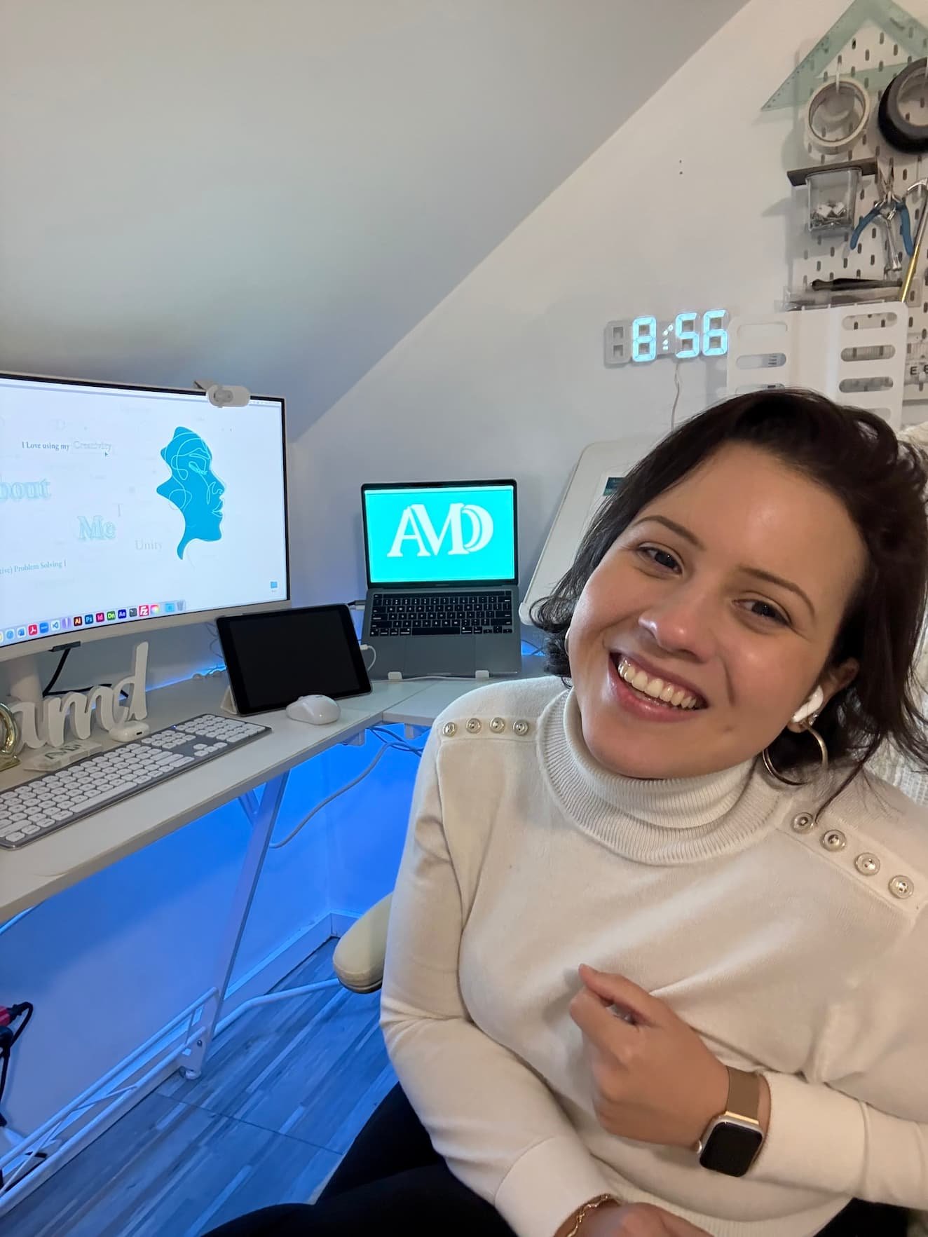 Ana working at her computer in the design studio